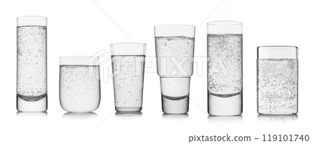 Sparkling mineral water with bubbles in various shape and size glasses on white background. 119101740
