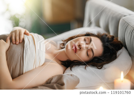 woman is sleeping in the bedroom woman is sleeping in the bedroom 119101760