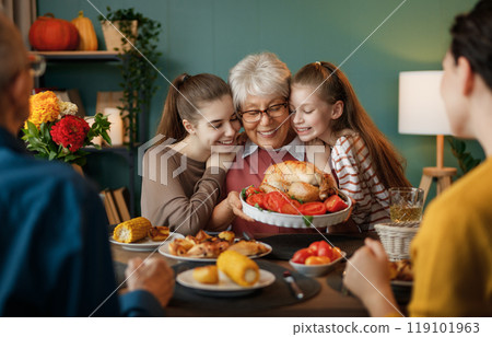 Family celebrating Thanksgiving Day 119101963