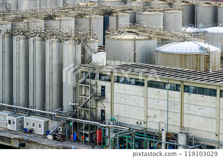 Multiple various sizes steel silos to storage chemical products at tank farm Multiple various sizes steel silos to storage chemical products at tank farm 119103029