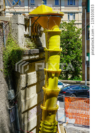 Yellow prefabricated plastic construction debris pipe elements hammered together for lowering debris Yellow prefabricated plastic construction debris pipe elements hammered together for lowering debris 119103033