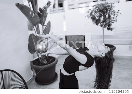 A Dynamic Dance Pose Captured Beautifully Amidst Lush Indoor Greenery And Plants A Dynamic Dance Pose Captured Beautifully Amidst Lush Indoor Greenery And Plants 119104395