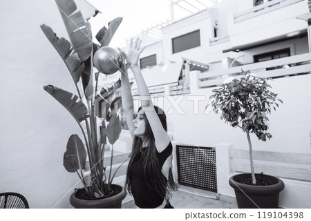 Engaging in a Dynamic Outdoor Sports Activity that Involves Using a Ball for Fun and Exercise 119104398