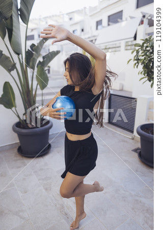 A stunning and dynamic dance pose featuring a globe set in a beautifully modern environment A stunning and dynamic dance pose featuring a globe set in a beautifully modern environment 119104399