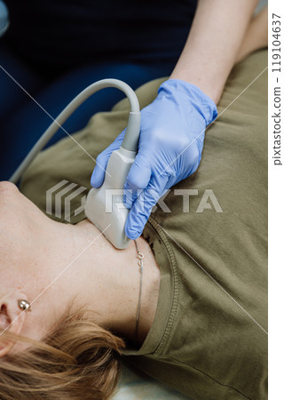 Healthcare professional performing neck ultrasound examination. Medical, health, and diagnostics 119104637