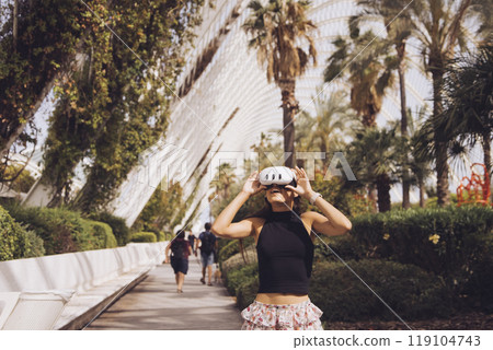 Engaging in vibrant urban exploration, surrounded by palm trees and stunning scenic architecture Engaging in vibrant urban exploration, surrounded by palm trees and stunning scenic architecture 119104743