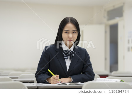 High school girls studying, looking at the camera, photo courtesy of Ariake College of Education and Arts High school girls studying, looking at the camera, photo courtesy of Ariake College of Education and Arts 119104754