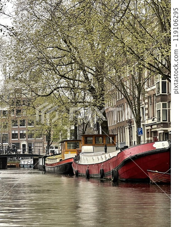 Traditional boats and canals in Amsterdam, Netherlands, Europe Traditional boats and canals in Amsterdam, Netherlands, Europe 119106295