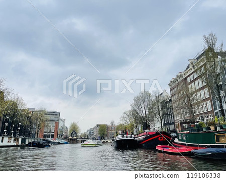 Traditional boats and canals in Amsterdam, Netherlands, Europe 119106338