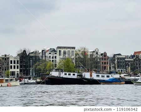 Traditional boats and canals in Amsterdam, Netherlands, Europe 119106342