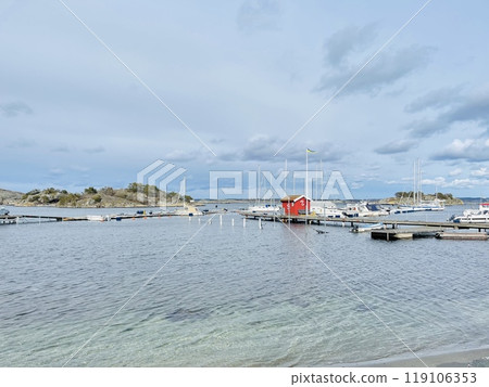 A view of red wooden houses on Donso Archipelago island . 119106353