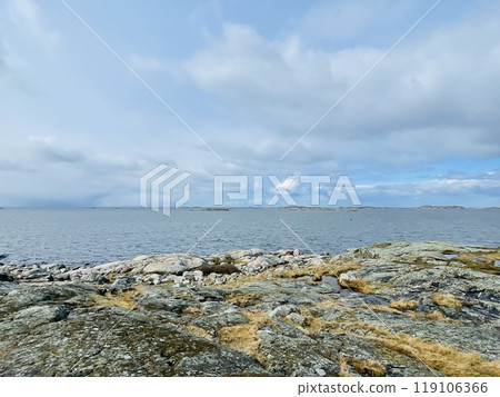 A view of red wooden houses on Vrango Archipelago island . A view of red wooden houses on Vrango Archipelago island . 119106366
