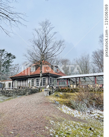 A view of red wooden houses on Vrango Archipelago island . A view of red wooden houses on Vrango Archipelago island . 119106369
