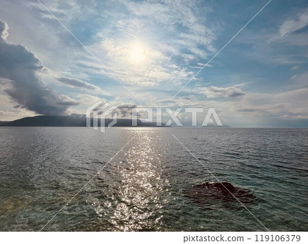 Rocky beach and crystal turquoise water of Ionian Sea in Albania. 119106379