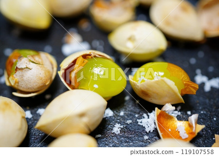 Ginkgo nuts dry roasted in a frying pan Ginkgo nuts dry roasted in a frying pan 119107558