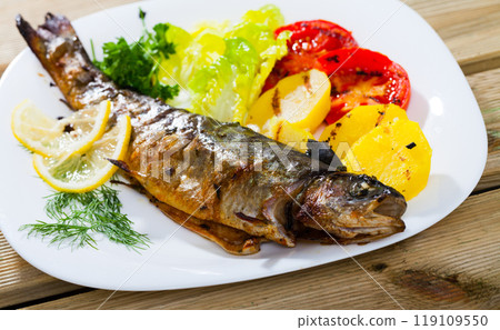 Baked trout with vegetables Baked trout with vegetables 119109550