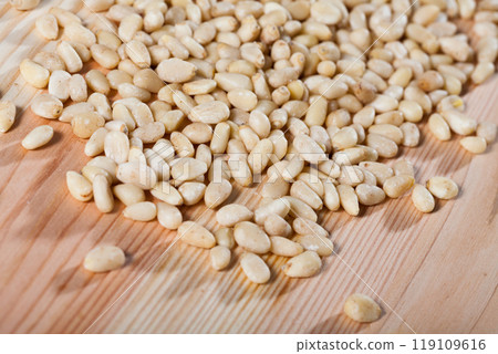 Picture of raw pine nut on the wooden desk, nobody 119109616