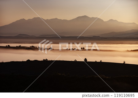 Beautiful morning mist on the hills and land Beautiful morning mist on the hills and land 119110695