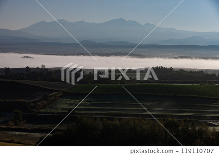 Beautiful morning mist on the hills and land 119110707