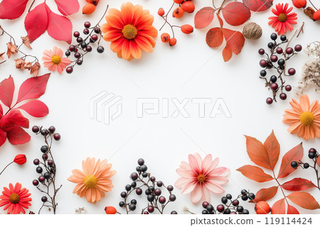 Autumn-themed frame with vibrant orange and red leaves, white and red flowers, berries, and dried branches on a white background. Autumn-themed frame with vibrant orange and red leaves, white and red flowers, berries, and dried branches on a white background. 119114424