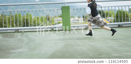 Junior high school girls running on the school roof Junior high school girls running on the school roof 119114505
