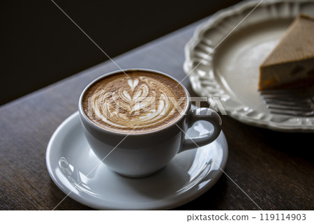 Exquisite latte art latte and delicious cheesecake Exquisite latte art latte and delicious cheesecake 119114903