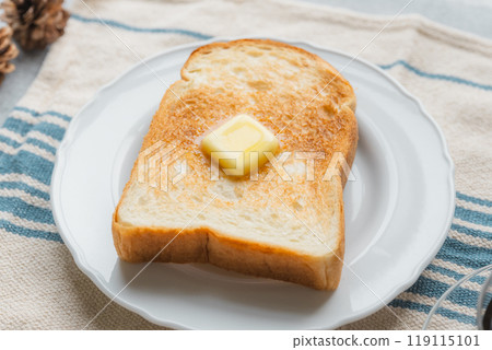 A breakfast of toast with melting butter 119115101