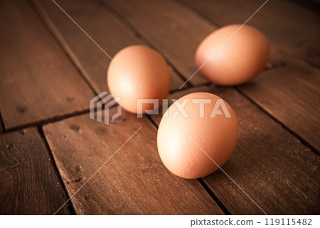 Eggs on a rustic wooden board Eggs on a rustic wooden board 119115482