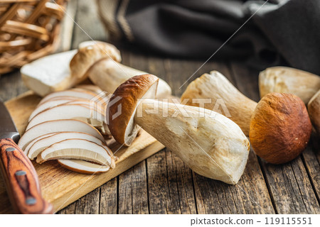 Fresh boletus mushrooms on wooden table. 119115551