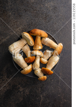 Fresh boletus mushrooms on kitchen table. Top view. 119115558