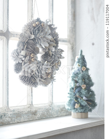 Christmas wreath and Christmas tree on the window sill 119117004