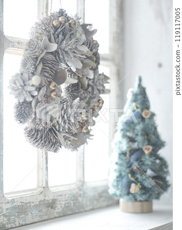 Christmas wreath and Christmas tree on the window sill 119117005