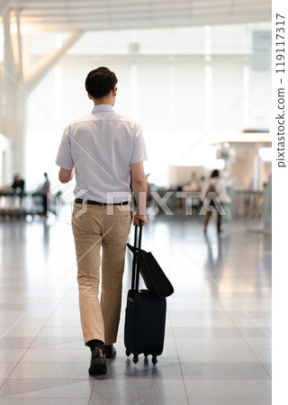 A businessman with a suitcase 119117317