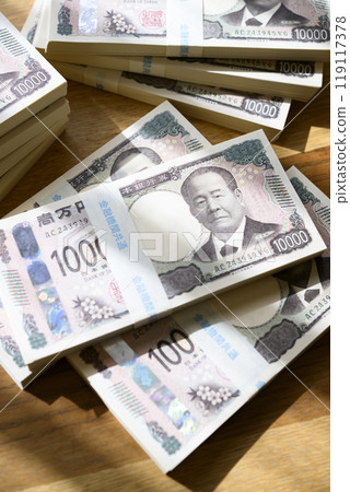 A stack of bills on a table (new bill version) 119117378
