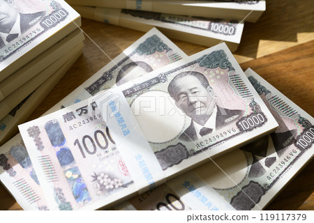 A stack of bills on a table (new bill version) 119117379