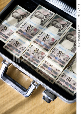 A stack of bills in an attaché case A stack of bills in an attaché case 119117383