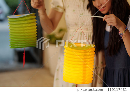 Family With Chinese Lanterns Outdoors Family With Chinese Lanterns Outdoors 119117481