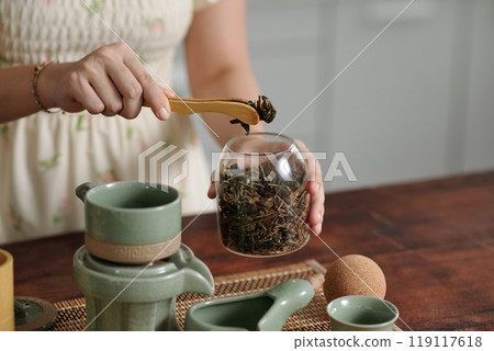 Woman Making Herbal Tea At Home Woman Making Herbal Tea At Home 119117618