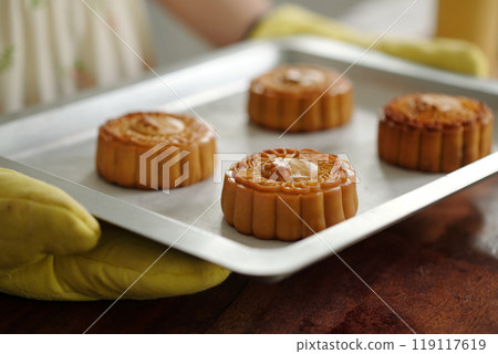 Woman Baking Moon Cakes For Holiday 119117619