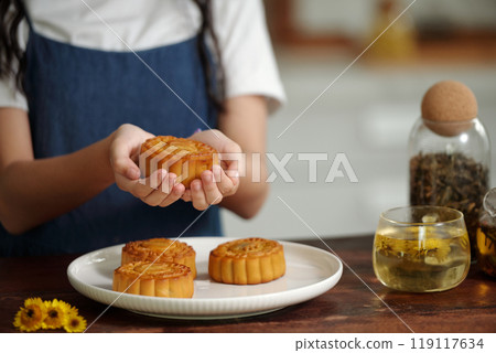 Girl With Homemade Moon Cakes 119117634