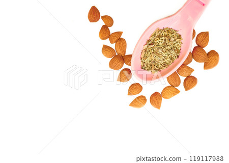 Spices. Spoon with mix of various aromatic dried herbs and apricot kernels Spices. Spoon with mix of various aromatic dried herbs and apricot kernels 119117988