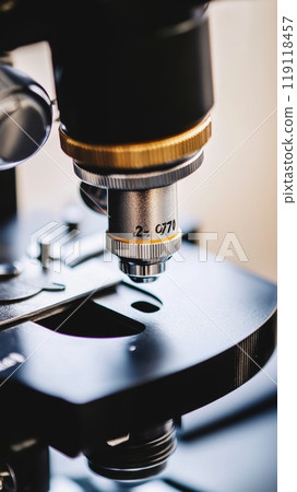 Extreme close up of a microscope objective lens showing precise numerical aperture markings, demonstrating scientific precision and technology 119118457