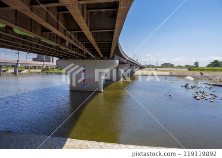A large bridge girder curved over the river A large bridge girder curved over the river 119119892