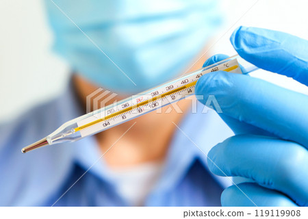 Doctor holding human body temperature thermometer to measure the fever at 37.5 degrees. 119119908
