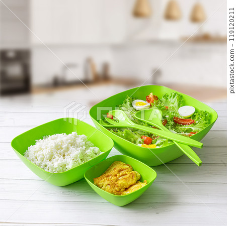 Healthy Green salad with tuna, corn, carrots, rice, and olives on white table background. Mexican corn salad. Healthy Green salad with tuna, corn, carrots, rice, and olives on white table background. Mexican corn salad. 119120211