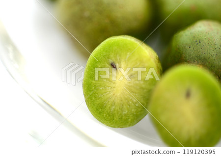 Cut fruits on a glass plate - Close-up of a sliced monkey pear Cut fruits on a glass plate - Close-up of a sliced monkey pear 119120395