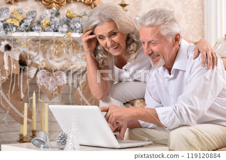 couple old and mature seniors enjoying and having fun together celebrating the new year couple old and mature seniors enjoying and having fun together celebrating the new year 119120884