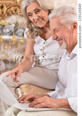 couple old and mature seniors enjoying and having fun together celebrating the new year couple old and mature seniors enjoying and having fun together celebrating the new year 119120889