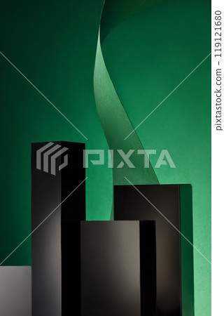 The product displays appear luxurious against an emerald backdrop, surrounded by empty dark cube podiums made of glass and stacked for presentation with a wavy green paper ribbon behind. 119121680