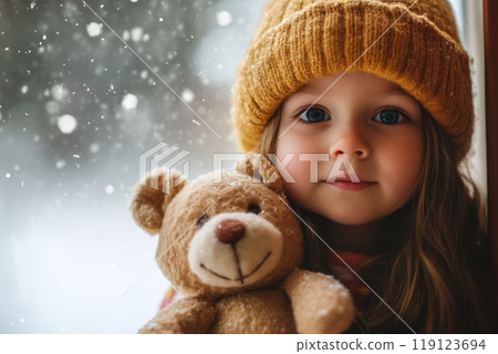 closeup portrait of Cute little girl hugging a teddy bear on winter day. Safe Toys and Gifts Month concept closeup portrait of Cute little girl hugging a teddy bear on winter day. Safe Toys and Gifts Month concept 119123694